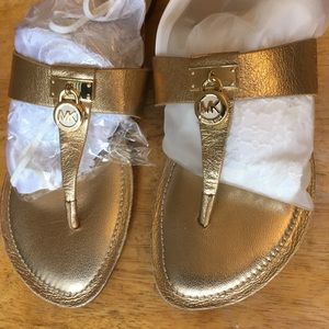 Michael Kors golden thongs size 9